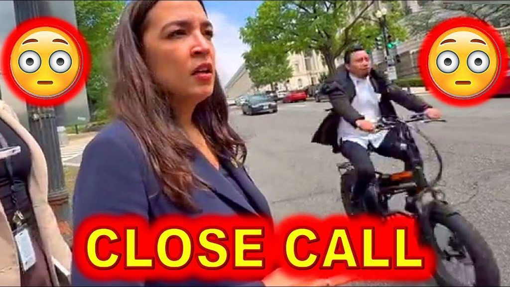 AOC Almost RUNOVER by a BIKER While RUNNING From Reporter…..